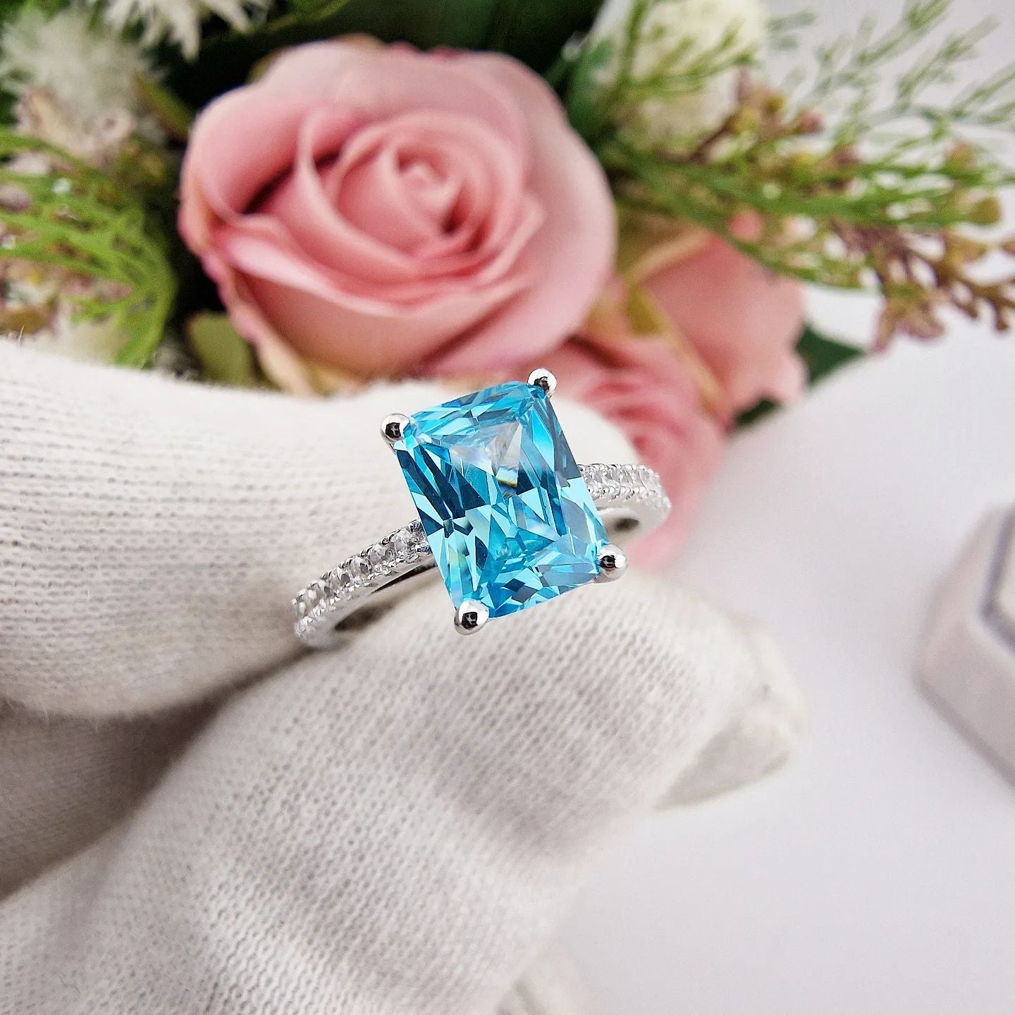 925 Sterling Silver Blue Emerald Cut Cz with Round Cz Shoulders Ring