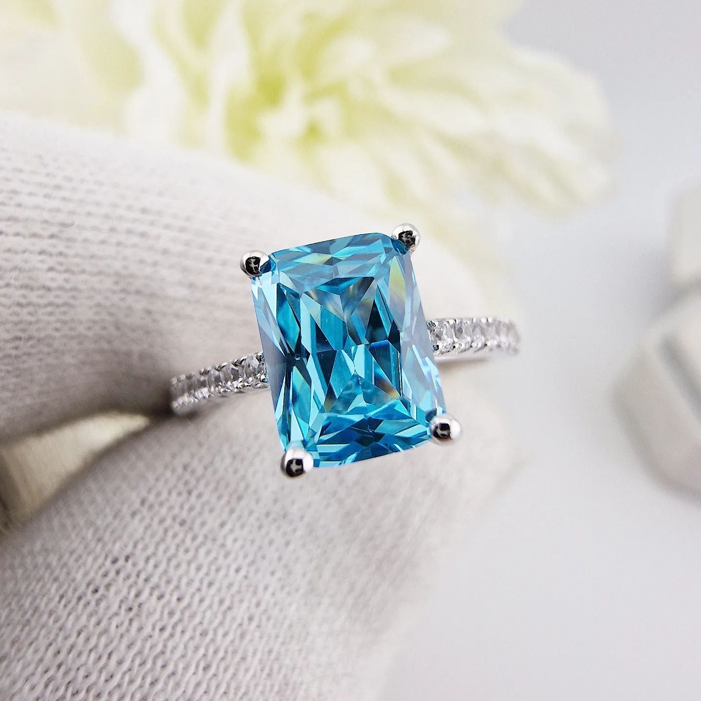 925 Sterling Silver Blue Emerald Cut Cz with Round Cz Shoulders Ring